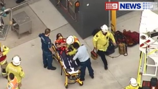 A man has suffered neck injuries in a fall from a ladder at a Darra work site.