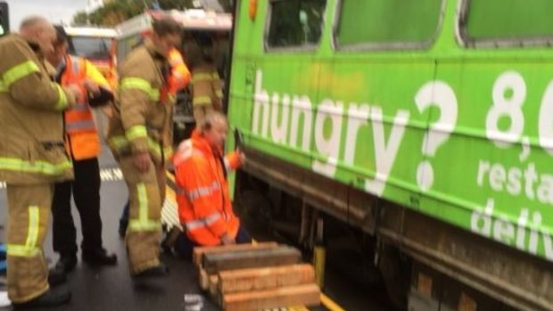 Yarra Trams workers and firefighters worked together to jack up the tram and free the woman.