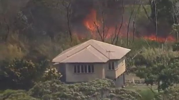 Houses are under threat from a large fire on Russell Island.