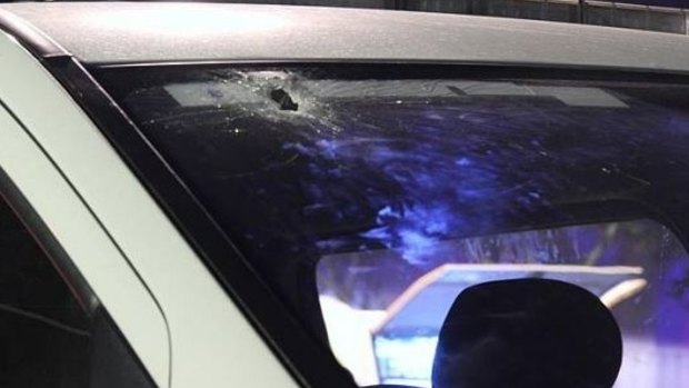 A bullet hole in a police vehicle after the Banyo siege.