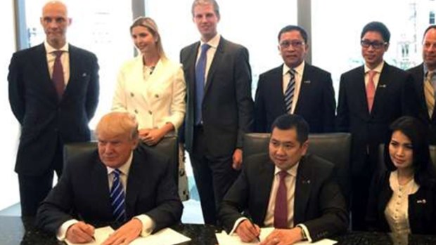 With his children Ivanka and Eric Jr behind him, Donald Trump, front left, signed a Bali hotel management agreement with Hary Tanoesoedibjo, front centre, in 2015.