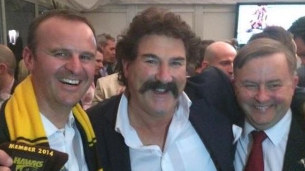 Andrew Barr, a self-described Hawthorn tragic. He tweeted this picture after the 2014 grand final, taken with Hawthorn legend Robert Dipierdomenico and Labor MP Anthony Albanese. He did not claim a taxpayer subsidy for this game.