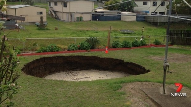 The Ipswich couple woke to this hole in their backyard.