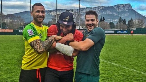 Reluctant Wallaby: Cooper and Drew Mitchell force an Australian cap on Ma'a Nonu in Toulon.