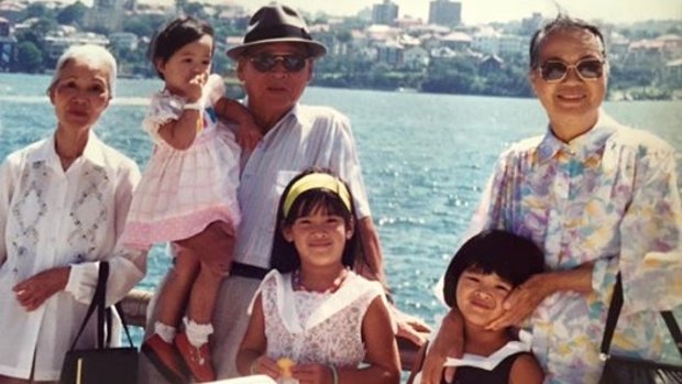 Giselle (front) with her Bà Nội, sister Arielle, paternal grandfather Ông Nội, sister Cybelle, and Bà Ngoại. It was taken in Sydney in 1992.