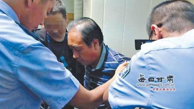 Gao Chengyong, being arrested in Baiyin City, Gansu. 