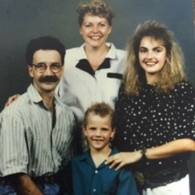 Before Courtney Act ... Shane Jenek with his parents and older sister.