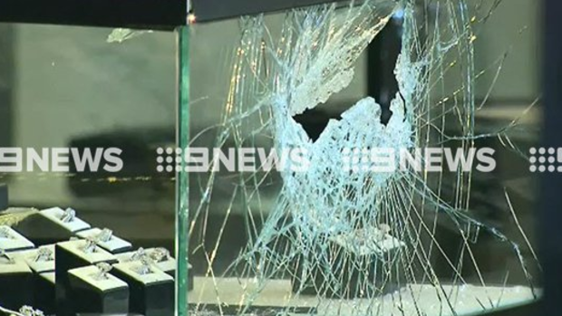 The smashed window of a Canterbury jewellery store after it was robbed on Thursday.