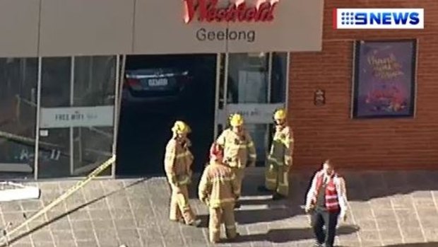 Firefighters outside Westfield Geelong shopping centre.