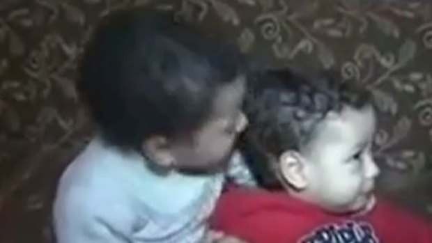 Egyptian toddler Ahmed Mansour Qorani Sharara (in white) was convicted of murder last week. Now the Egyptian military says it was a case of mistaken identity.