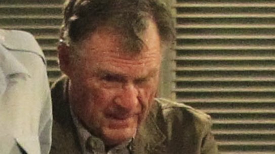 Murderer Ian Turnbull is escorted out of court during the trial.