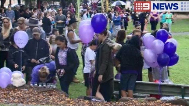 Hundreds attended a candlelight vigil for the 12-year-old, who was found dead at Pimpama.