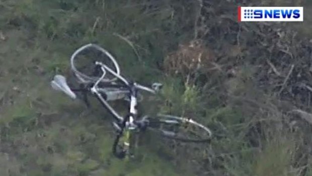 A mangled bicycle at the scene of the crash.