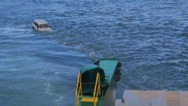 A 4WD rolled off a barge near Fraser Island and into the Great Sandy Strait.