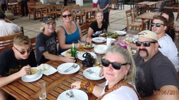 55-year-old Yandina man Rex Tickell (right side of table with moustache, wearing sunglasses and cap) died while on holiday in Thailand on July 2.