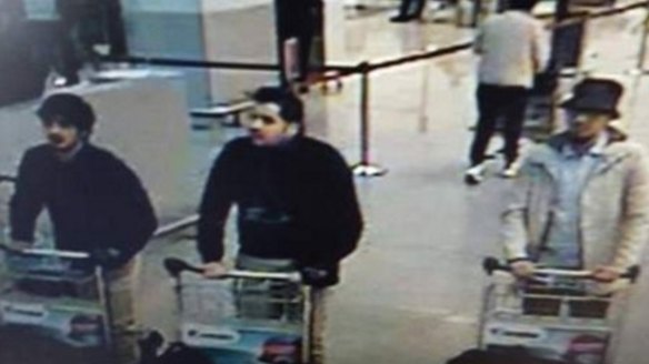 Nam Laachraoui, left captured on CCTV, moments before the blast with two other bombers. 