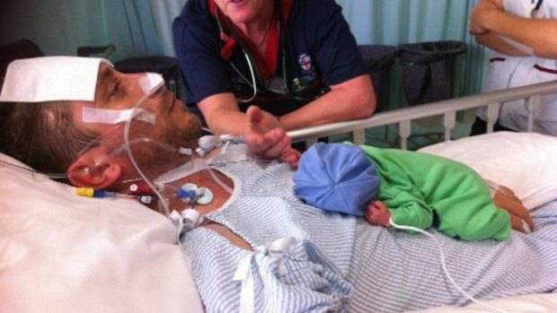 Ben was paralysed before his new baby son, James, was a fortnight old. 