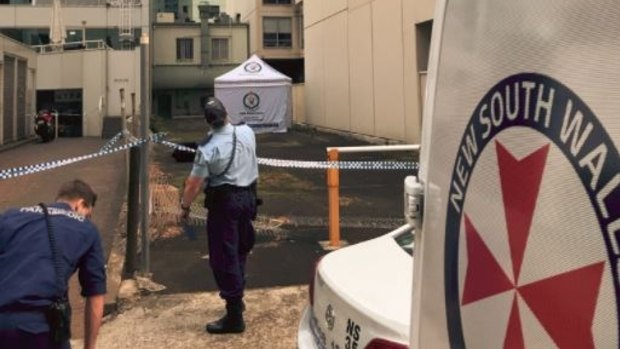 A tent covered the body of a woman found dead in the Chatswood alley. 