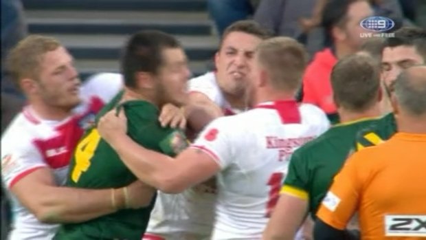 Biff is back: Sam Burgess punches David Klemmer in the Four Nations in 2016.