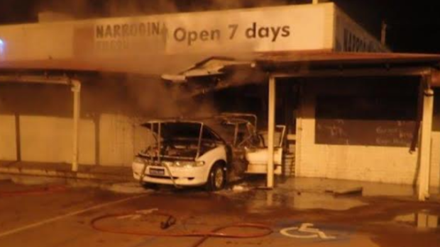 Smoke rises from the Narrogin supermarket where thieves caused $100,000 damage in a ram-raid.