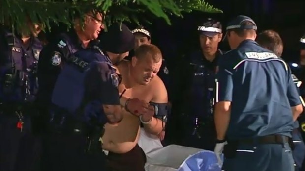 A man is retrieved from a Gold Coast canal on Thursday night.