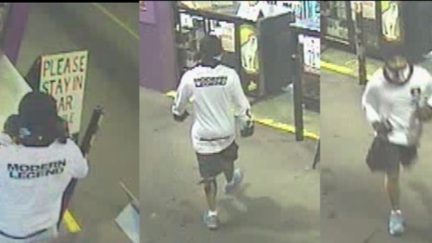 A man wanted over an attack on a bottle shop worker in Logan was wearing wearing a white long-sleeved shirt with ???Modern Legend??? written on the back, black shorts, white shoes and a black bandana.