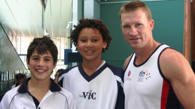 Young gun: A young Ben Simmons (middle) with Melbourne footballer Christian Petracca and Collingwood coach Nathan Buckley.