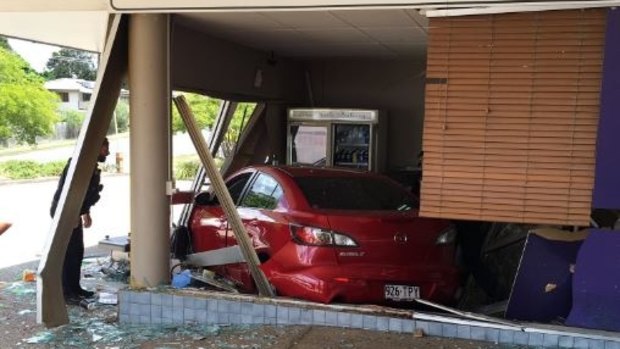 A car has crashed into a bakery in Ferny Hills, with the driver trapped for about 25 minutes before he was freed.