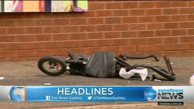 A child's pram lies wrecked after the accident on Canterbury Road, Belmore.