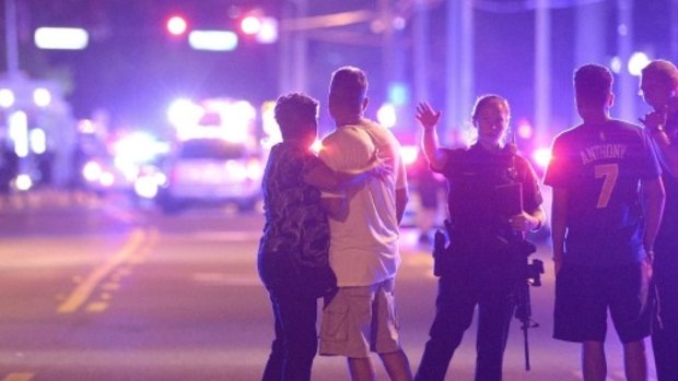 Police direct people away from the Pulse nightclub in Orlando during the shooting.