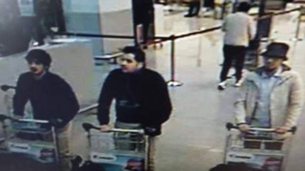 Nam Laachraoui, left captured on CCTV, moments before the blast with two other bombers. 