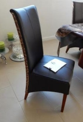 One of the leather chairs Eman Sharobeem is accused of buying with public funds at ICAC.