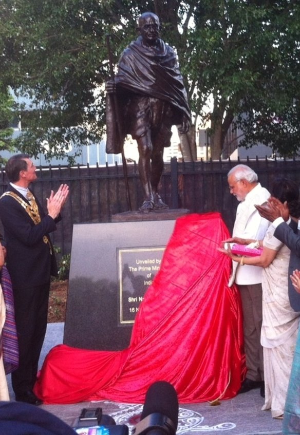 Indian Prime Minister Narendra Modi and Brisbane Lord Mayor Graham Quirk unveil a statue for Mahatma Gandhi in Brisbane.