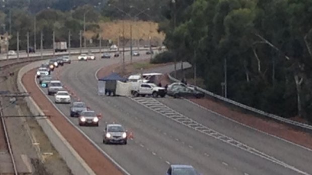A forensic tent was set up by homicide detectives on the Mitchell Freeway on Saturday after the discovery of a woman's body.