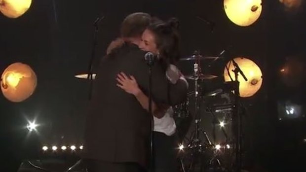 James Corben goes in for the hug at the end of Amy Shark's performance