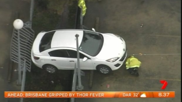 The vehicle dangles off the edge of the Westmead Hospital car park.