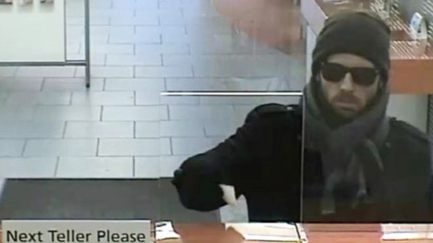 This bearded bank robber in New York is making waves for his chic fashion sense. 