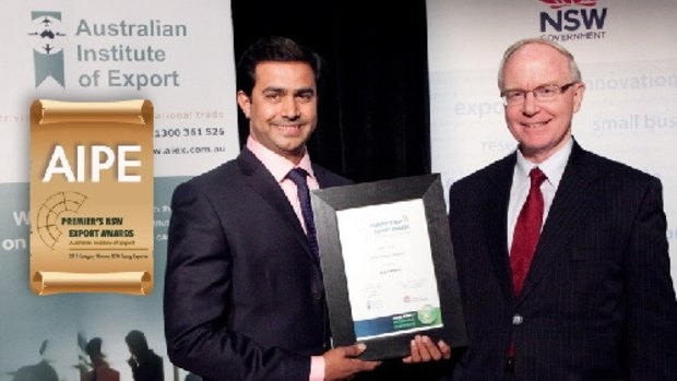 AIPE chief executive Amjad Khanche accepting an award from the NSW government.