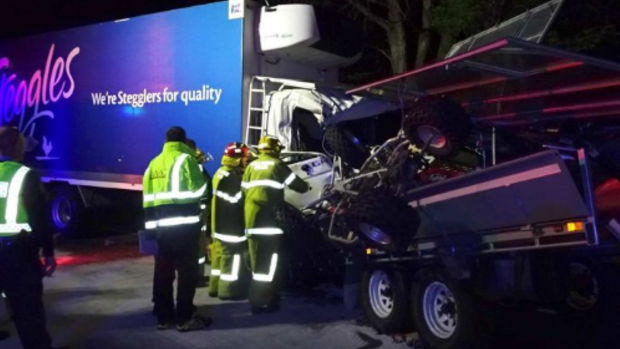 A truck driver has died after his truck was hit by a trailer which broke loose from the caravan it was being towed by.