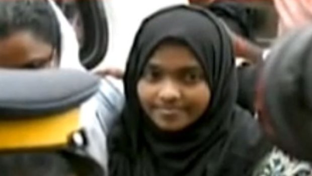 Hadiya who converted from Hinduism to Islam and married a Muslim man, arrives at the Kerala airport on Monday.