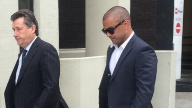 Former Eagle Daniel Kerr (right) arrives at the Perth Magistrates Court for an earlier appearance.