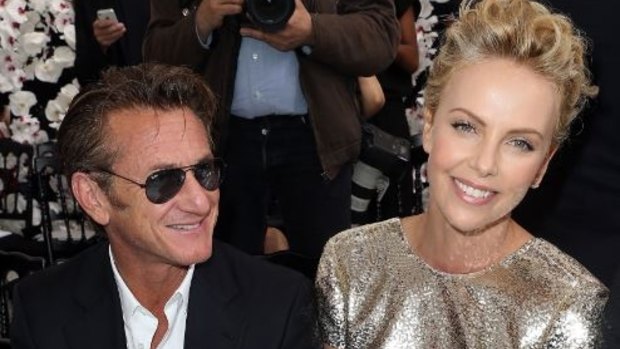 Sean Penn and Charlize Theron attend the Christian Dior show as part of Paris Fashion Week - Haute Couture Fall/Winter 2014-2015.