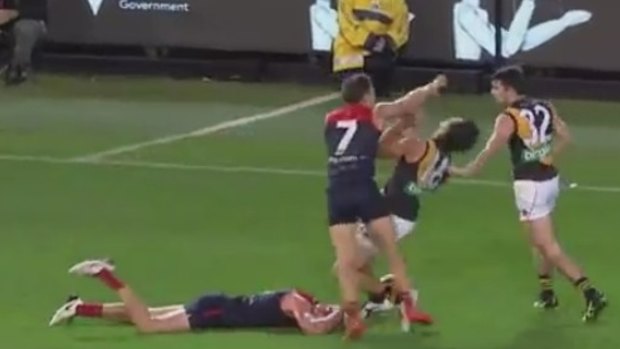 Melbourne player remonstrate with Alex Rance.