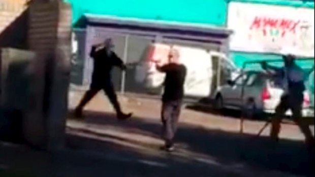 Screen grab from video taken at Warners Bay where a man with a knife was shot by police. 