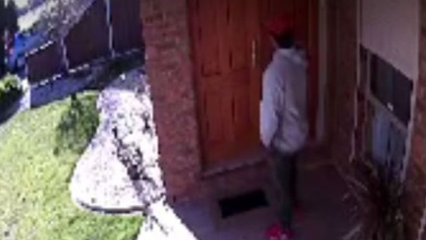 A screenshot from CCTV footage shows a man at the front door of Mr Medina's parents' home in Taylors Lakes. 