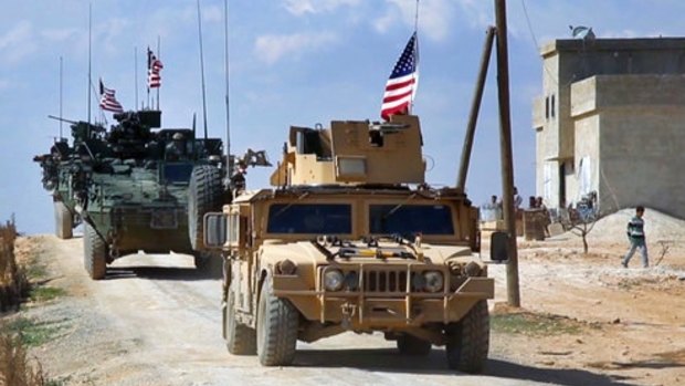 US forces patrolling on the outskirts of the Syrian town of Manbij.