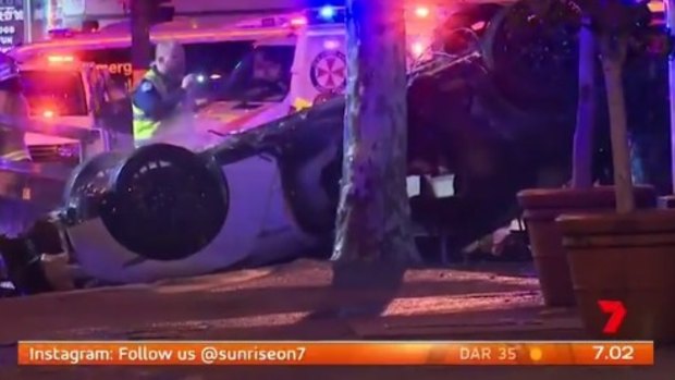 The overturned Nissan involved  in Saturday morning's deadly crash.