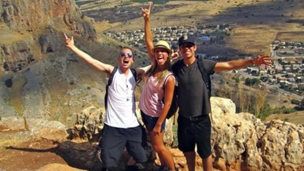 Max Steinberg (left) poses on a trip to Israel with his siblings Paige (centre) and Jake. 