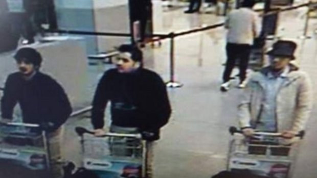 Nam Laachraoui, left captured on CCTV, moments before the blast with two other bombers. 