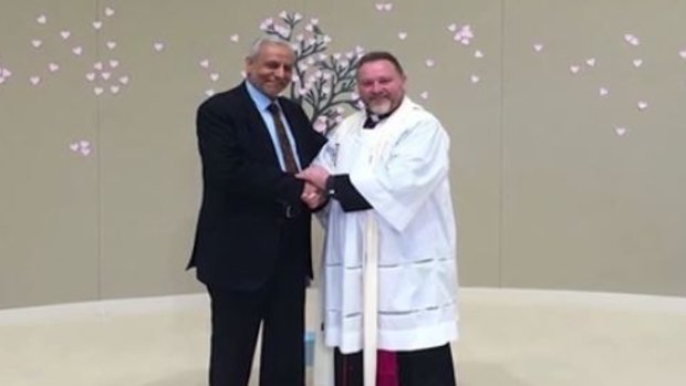 The Grand Mufti, Dr Ibrahim Abu Mohamed, is pictured in the Islamic State video shaking hands with inter-faith advocate and Anglican minister Father Rod Bowers.